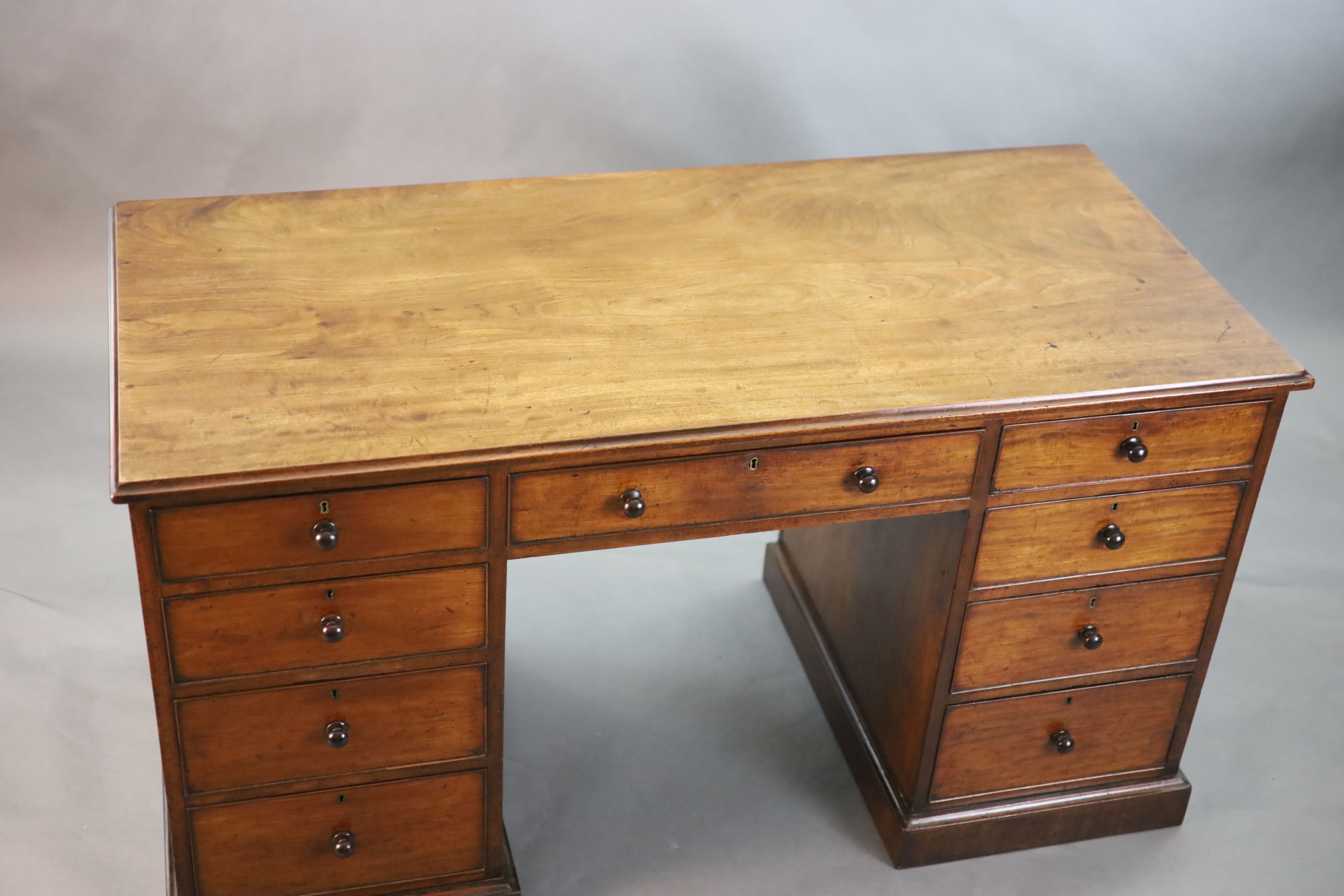 A George III mahogany kneehole desk, W.4ft 8in. D.2ft 2in. H.2ft 7in.